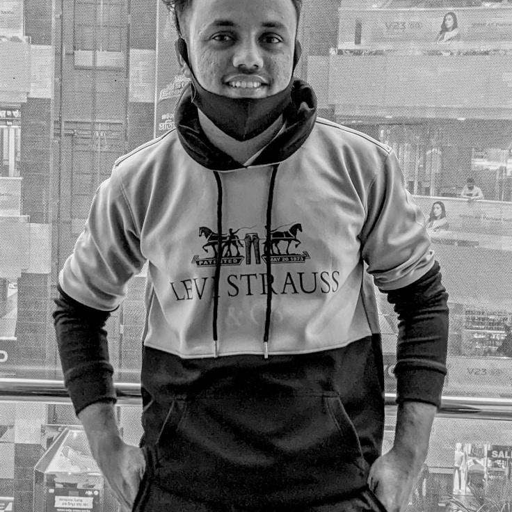 Avery Chen, Lead Design Curator at Global Process Framework, reviewing corporate floral arrangements